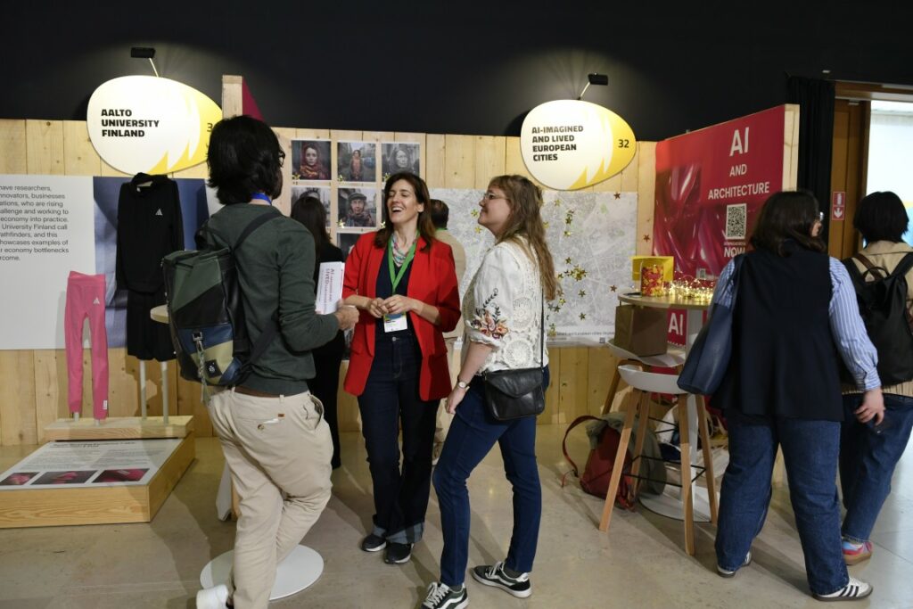 A group of people talking and networking at the exhibition stands during the NEB 2026 FAIR