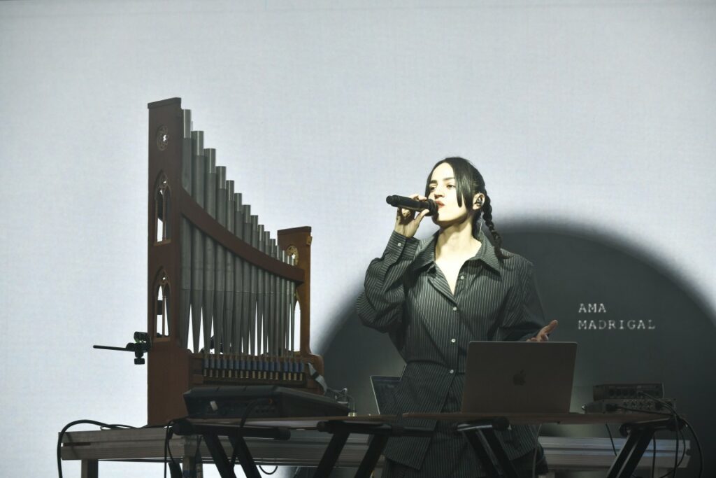 Ana Madrigal performing on stage during the cultural program of NEB 2026